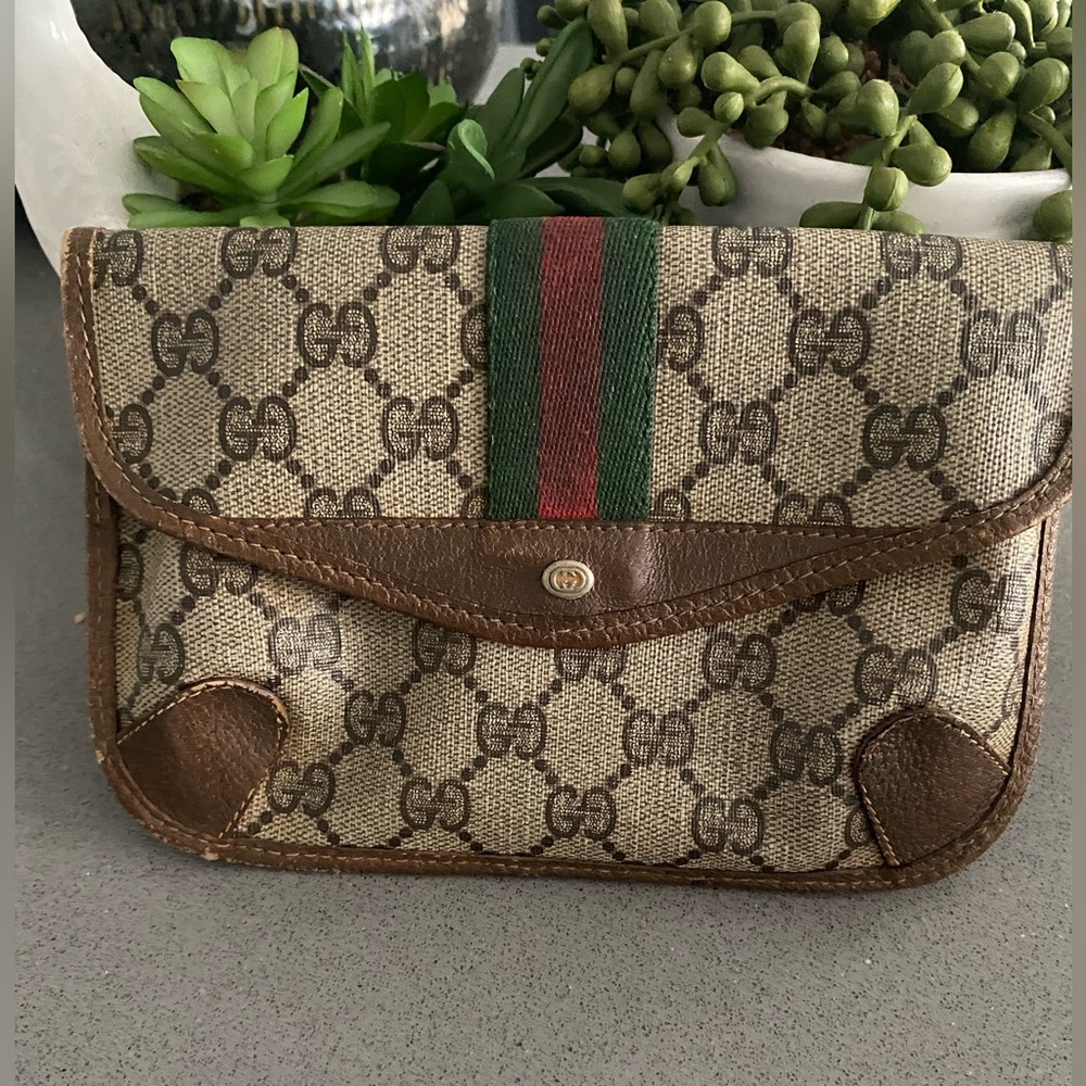 Authentic vintage Gucci mini clutch bag 8 inches across 5 inches in length.